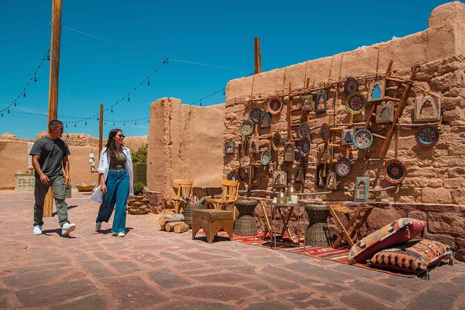 AlUla Old Town Experience - Mudbrick homes, stone remnants, and a view toward a 10th-century castle